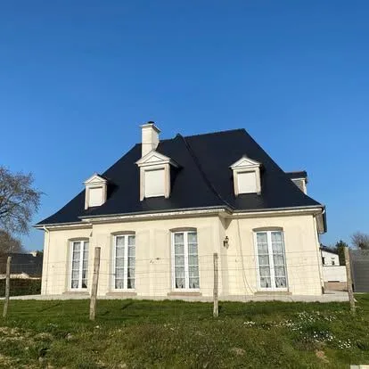 Maison avec toiture en ardoise rénovée